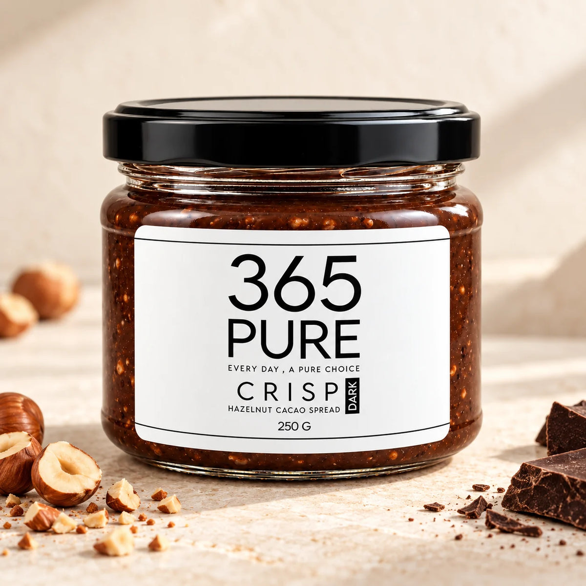 365Pure CRISP DARK hazelnut cacao spread 250 g jar with hazelnuts on warm stone